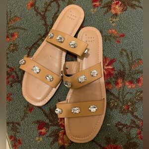 Ladies slide on banded sandal flats.